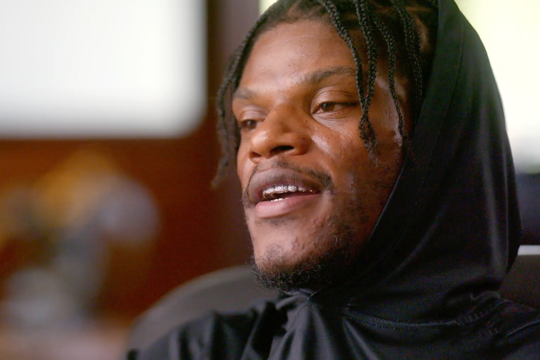 Lamar Jackson giving an interview in Field Generals: History of the Black Quarterback Season 1.