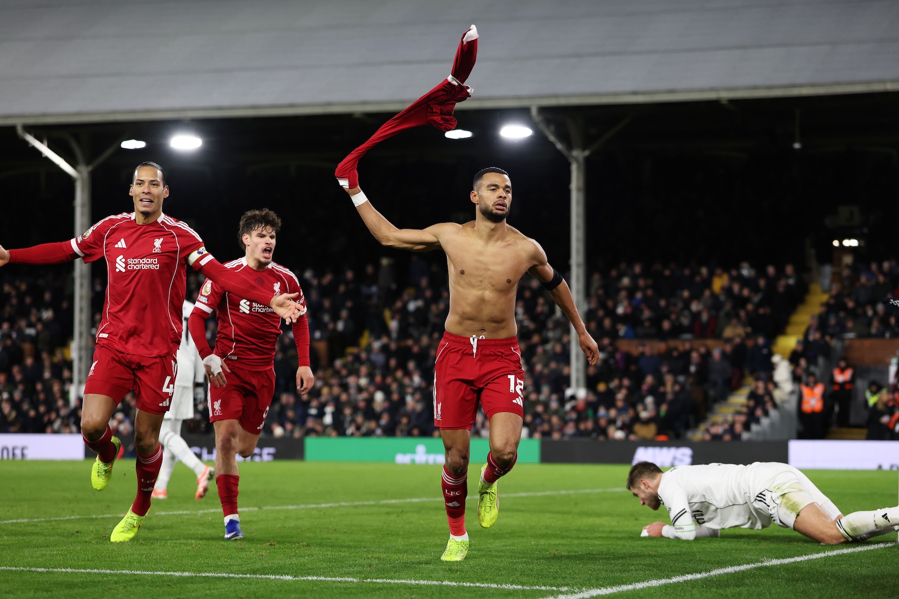 Cody Gakpo of Liverpool celebrates scoring his team's second goal with teammates Virgil van Dijk and Milos Kerkez.