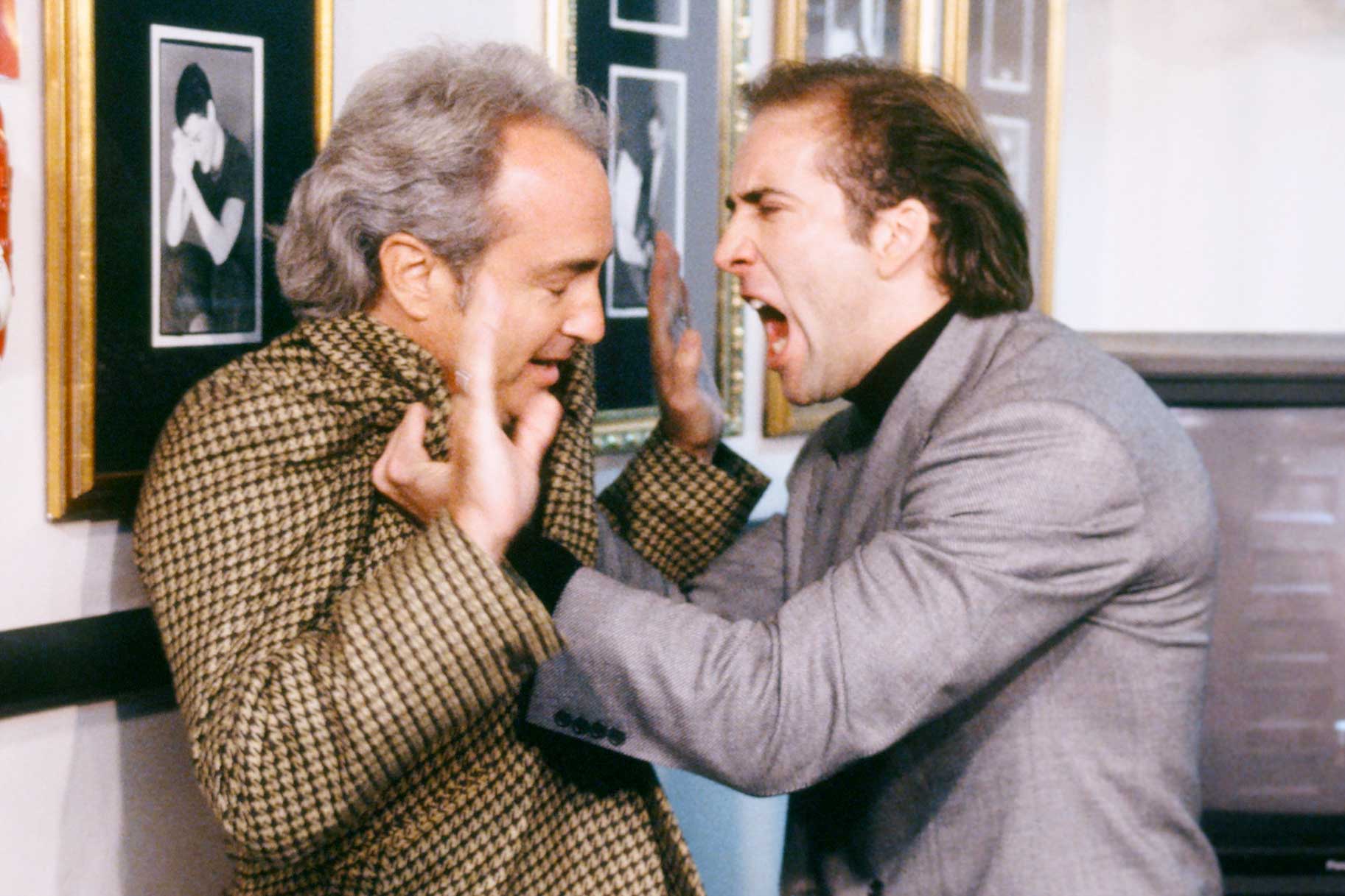 Nicolas Cage yelling at Lorne Michaels while pinning him against a wall during Saturday Night Live Season 18 Episode 1.