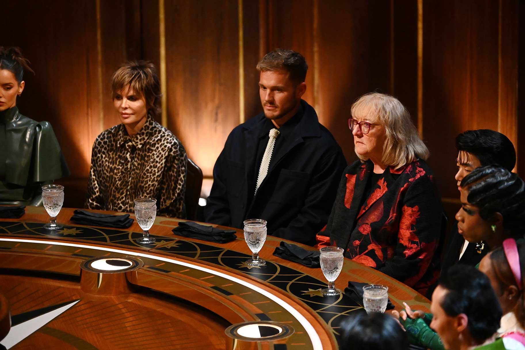Lisa Rinna, Colton Underwood, Donna Kelce, Eric Nam, and Monét X Change around the round table on The Traitors Season 4 Episode 1.&nbsp;