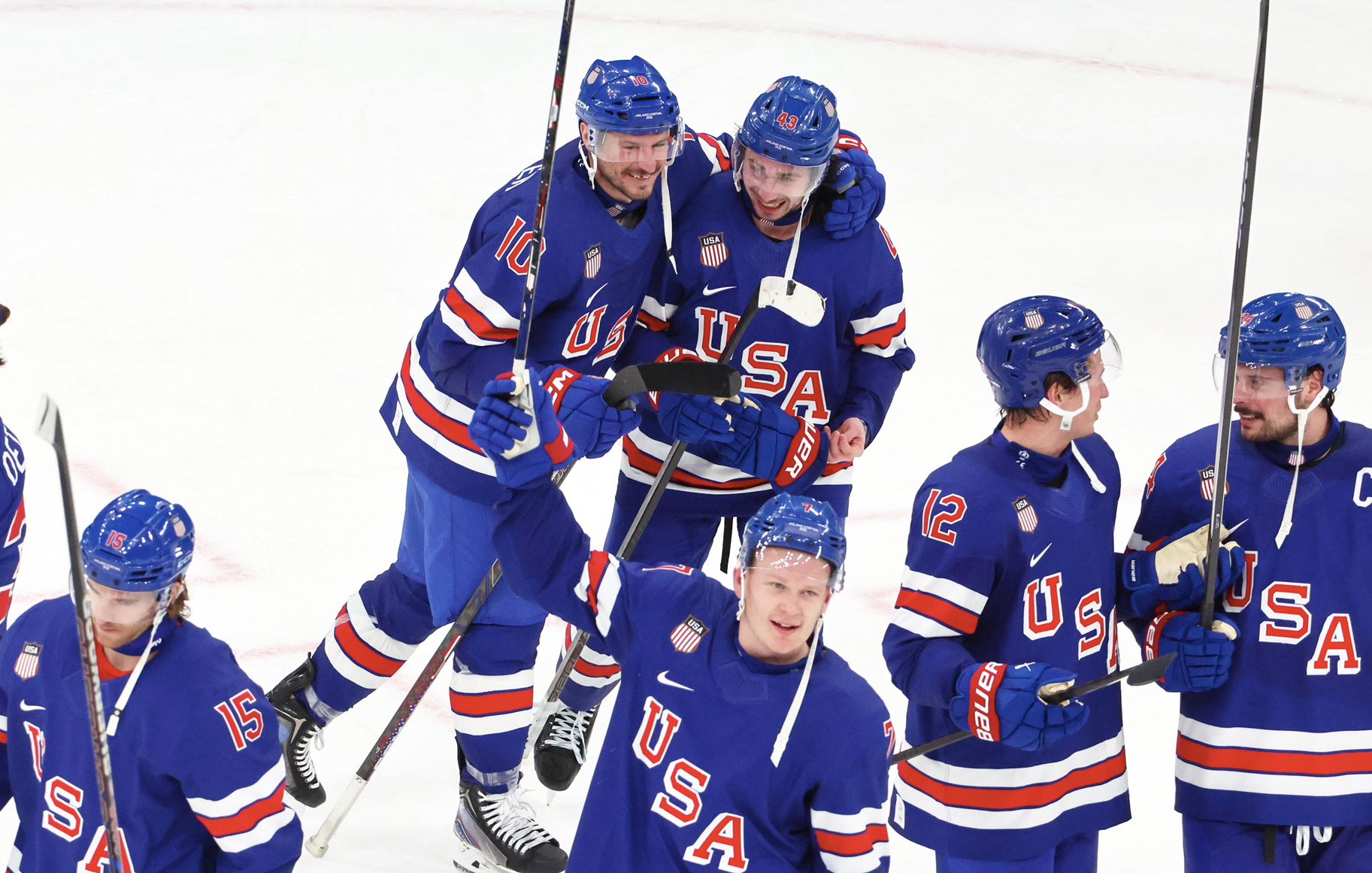 Quinn Hughes and JT Miller of the Men's Hockey Team USA celebrating his victory goal