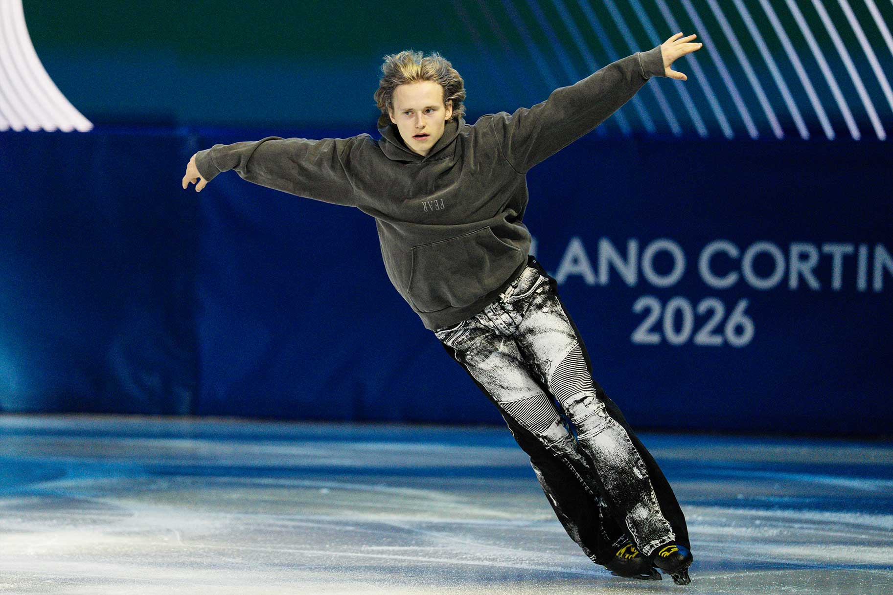 Ilia Malinin skating on the ice during the Milano Cortina 2026 Winter Olympics.