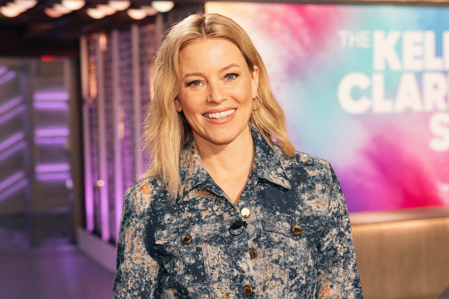 Elizabeth Banks wearing a blue pattern top on The Kelly Clarkson Show
