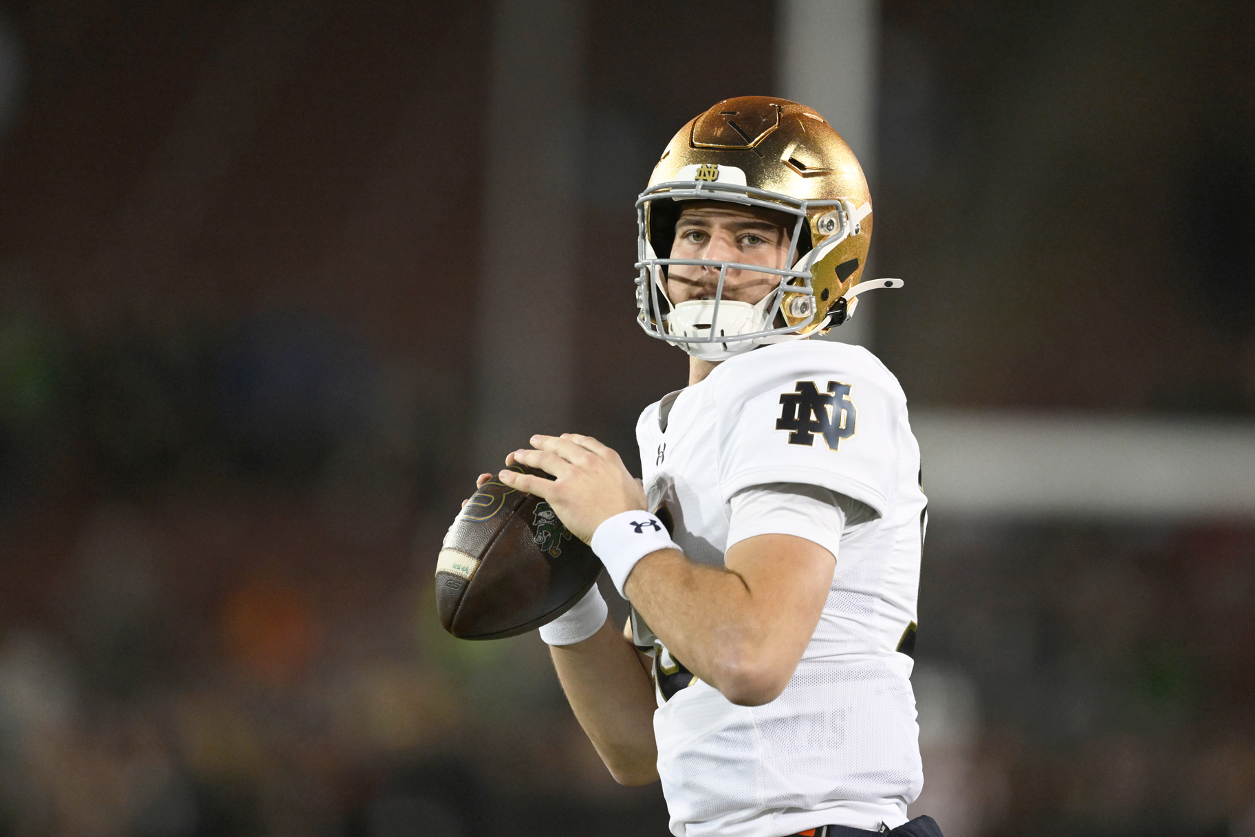 CJ Carr of the Notre Dame Fighting Irish warms up before the game against the Stanford Cardinal.