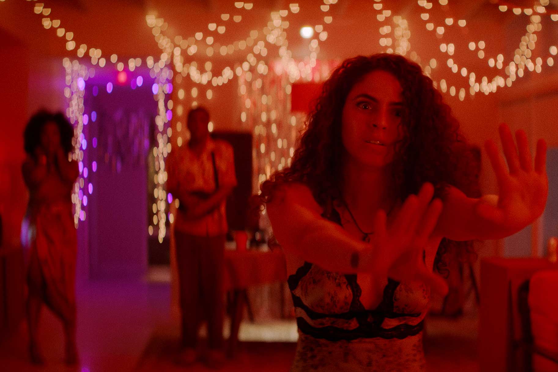 A woman holding her hands out in M.I.A. Season 1.