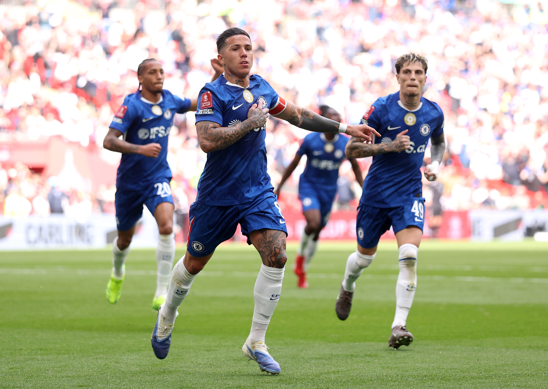 Enzo Fernandez of Chelsea celebrates scoring his team's first goal with teammates during the Emirates FA Cup Semi Final match.