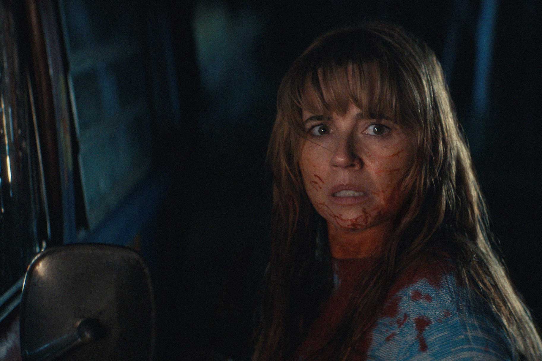 A close up of Pamela Voorhees with a fearful look in Crystal Lake Season 1.