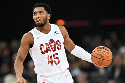 Donovan Mitchell of Cleveland Cavaliers dribbling a basketball on a basketball court