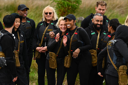 The Cast of The Traitors outside doing a challenge