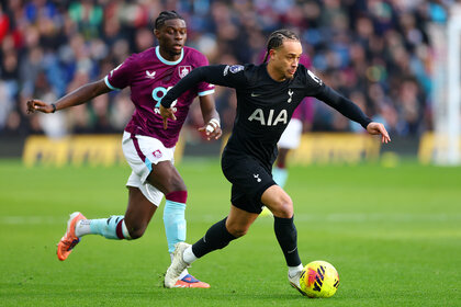 Lesley Ugochukwu of Burnley and Xavi Simons of Tottenham Hotspur running with the ball during the Premier League match between Burnley and Tottenham Hotspur.