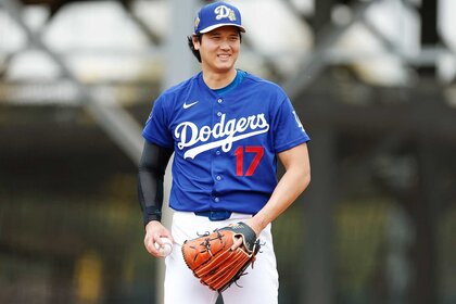 Shohei Ohtani of the Los Angeles Dodgers participates in a pitching drill during spring training workouts at Camelback Ranch.