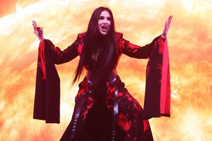 Tamara Živković singing in a red dress during the London Eurovision Party 2026.