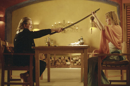 Uma Thurman and David Carradine holding swords in Kill Bill: The Whole Bloody Affair (2004).