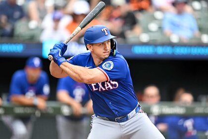 Wyatt Langford of the Texas Rangers bats during the third inning against the Baltimore Orioles.