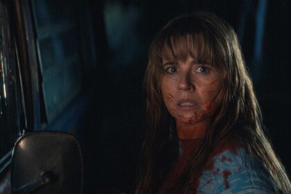 A close up of Pamela Voorhees with a fearful look in Crystal Lake Season 1.