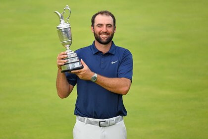 Scottie Scheffler of the United States holds The Claret Jug on the 18th green during the final round of The Open Championship.