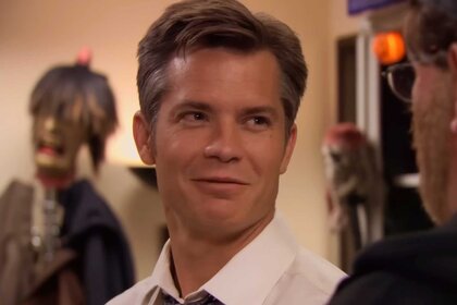 Danny Cordray smiling while talking to someone in The Office Season 7 Episode 6.