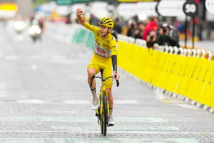 Tadej POGACAR of Slovenia celebrates winning his fourth Tour de France during the stage 21 of the Tour de France 2025.