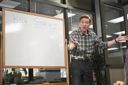 Ned Sampson (Domhnall Gleeson) writing on a whiteboard in The Paper Season 2.