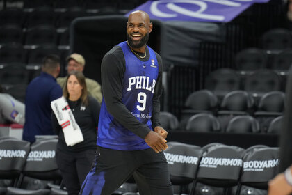 LeBron James #23 of the Philadelphia 76ers smiles during practice.