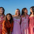 The full cast of The Five Star Weekend Season 1 standing in front of an ocean view.