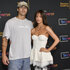 Maura Higgins and Rob Rausch posing together in front of a step and repeat.