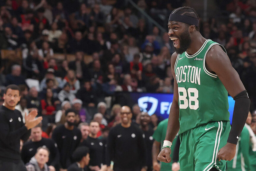 Neemias Queta of the Boston Celtics celebrates on the basketball court after getting a dunk