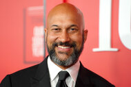 Keegan-Michael Key smiles on the red carpet during the TIME 100 gala