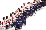 Players of the United States and Canada greet each other after the Para Ice Hockey Gold Medal Game between the United States and Canada.