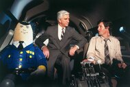 Dr. Rumack and Ted Striker sitting in the cockpit in Airplane! (1980).