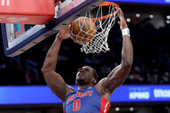 Jalen Duren of the Detroit Pistons dunks the ball against the Washington Wizards .
