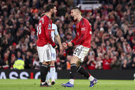 Benjamin Sesko and Bruno Fernandes of Manchester United celebrate a goal during a Premier League match.