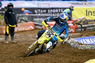 Ken Roczen on a dirtbike in the mud during the Monster Energy AMA Supercross Championship.