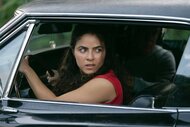 Etta looking back in a car in M.I.A. Season 1.