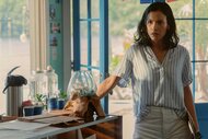 Leah walking through a kitchen in M.I.A. Season 1.