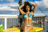 Megan Thee Stallion sitting in a bikini in Love Island USA Season 8 Episode 23.