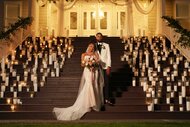 BelleJolie Force and Mecca Amen posing outside in front of wedding decor on Married at First Sight Season 20 Episode 1.