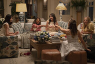 Gigi (Gemma Chan), Dru-Ann (Regina Hall), Brooke (D’Arcy Carden), Hollis (Jennifer Garner), and Tatum (Chloë Sevigny) sitting and laughing in The Five Star Weekend Season 1.