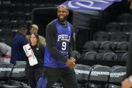 LeBron James #23 of the Philadelphia 76ers smiles during practice.