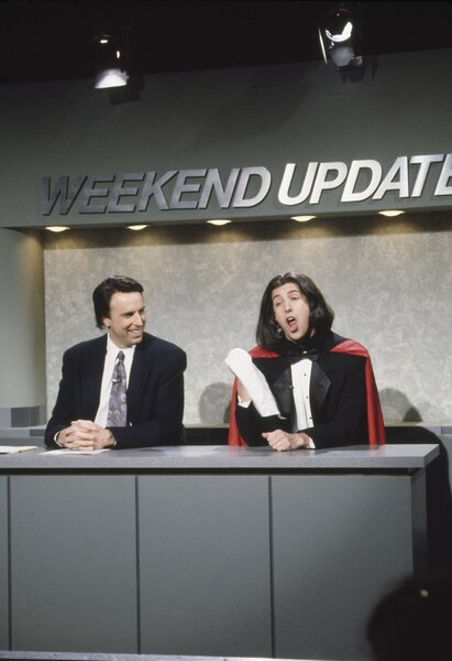Kevin Nealon and&nbsp;Opera Man (Adam Sandler) deliver the 'Weekend Update' on SNL 1717.