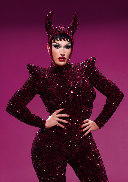 Plane Jane standing in front of a purple backdrop in House of Villains Season 3.