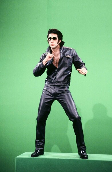 Nicolas Cage dressed as Elvis on a green-screen during Saturday Night Live Season 18 Episode 1.