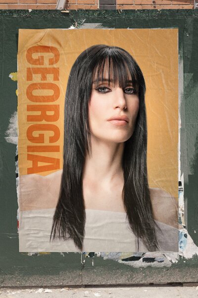 Georgia McCann on a poster in a NYC street.
