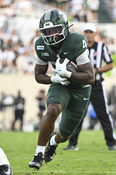 Jaziun Patterson of the Michigan State Spartans runs with the football during a game against the Eastern Michigan Eagles.