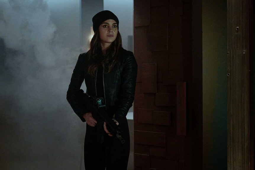 Michelle walking into a dark room in The Copenhagen Test Season 1 Episode 8.