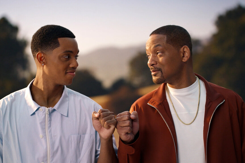 Will (Jabari Banks) and Will Smith standing outside facing each other and having a conversation together