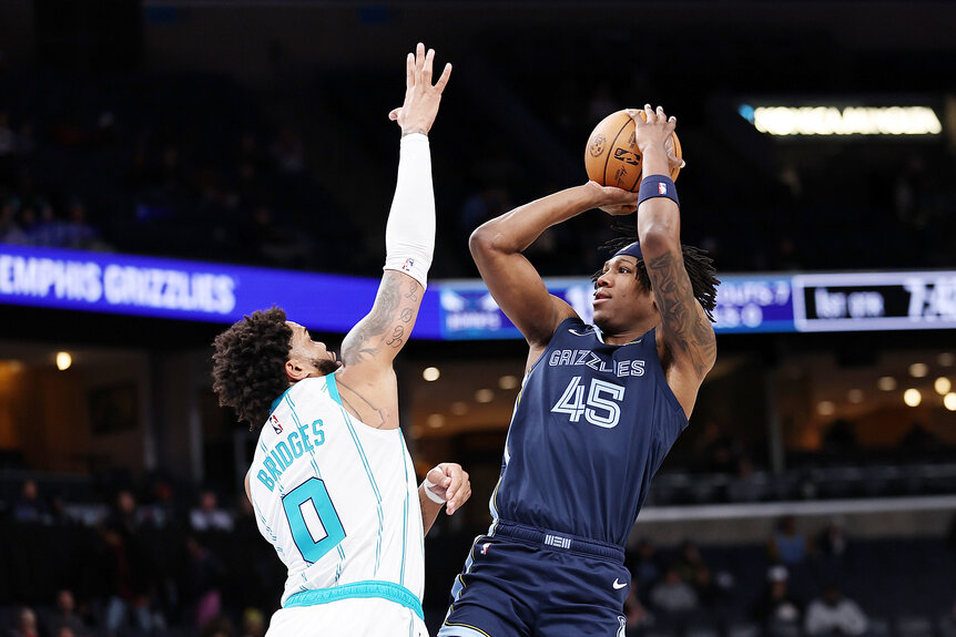 GG Jackson II of the Memphis Grizzlies takes a shot against Miles Bridges of the Charlotte Hornets.