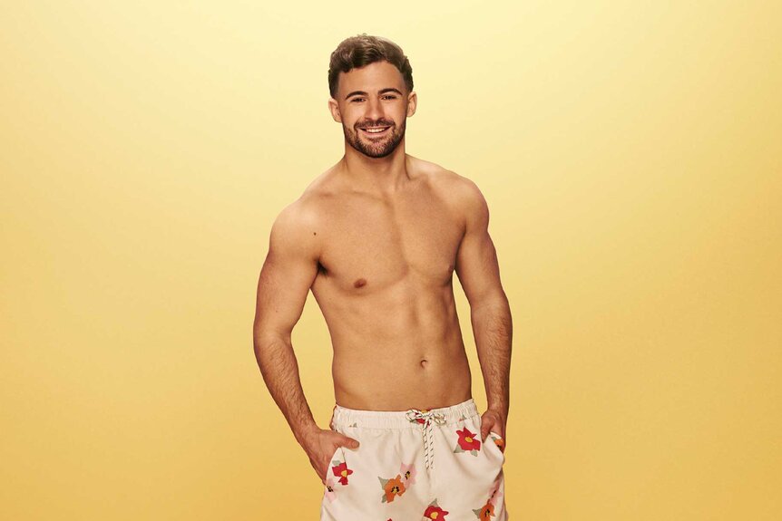 Ciaran smiling in swim shorts for Love Island: All Stars Season 3.