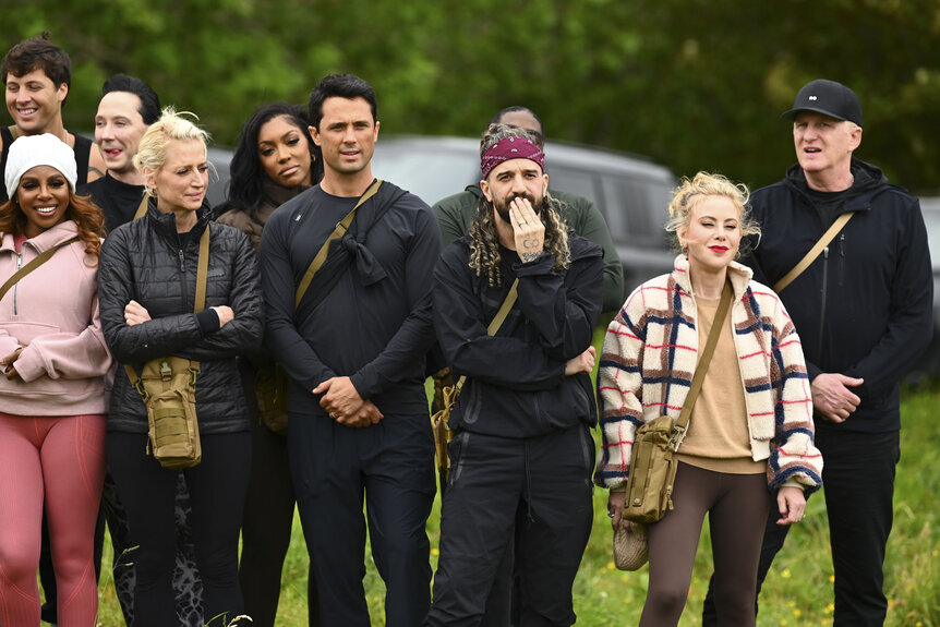Cast of The Traitors standing together outdoors in Season 4 Episode 1.