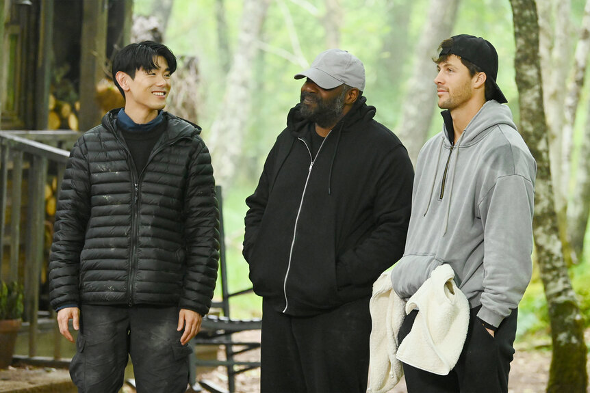 Eric Nam, Ron Funches, and Rob Rausch standing together outside on The Traitors Season 4 Episode 6.